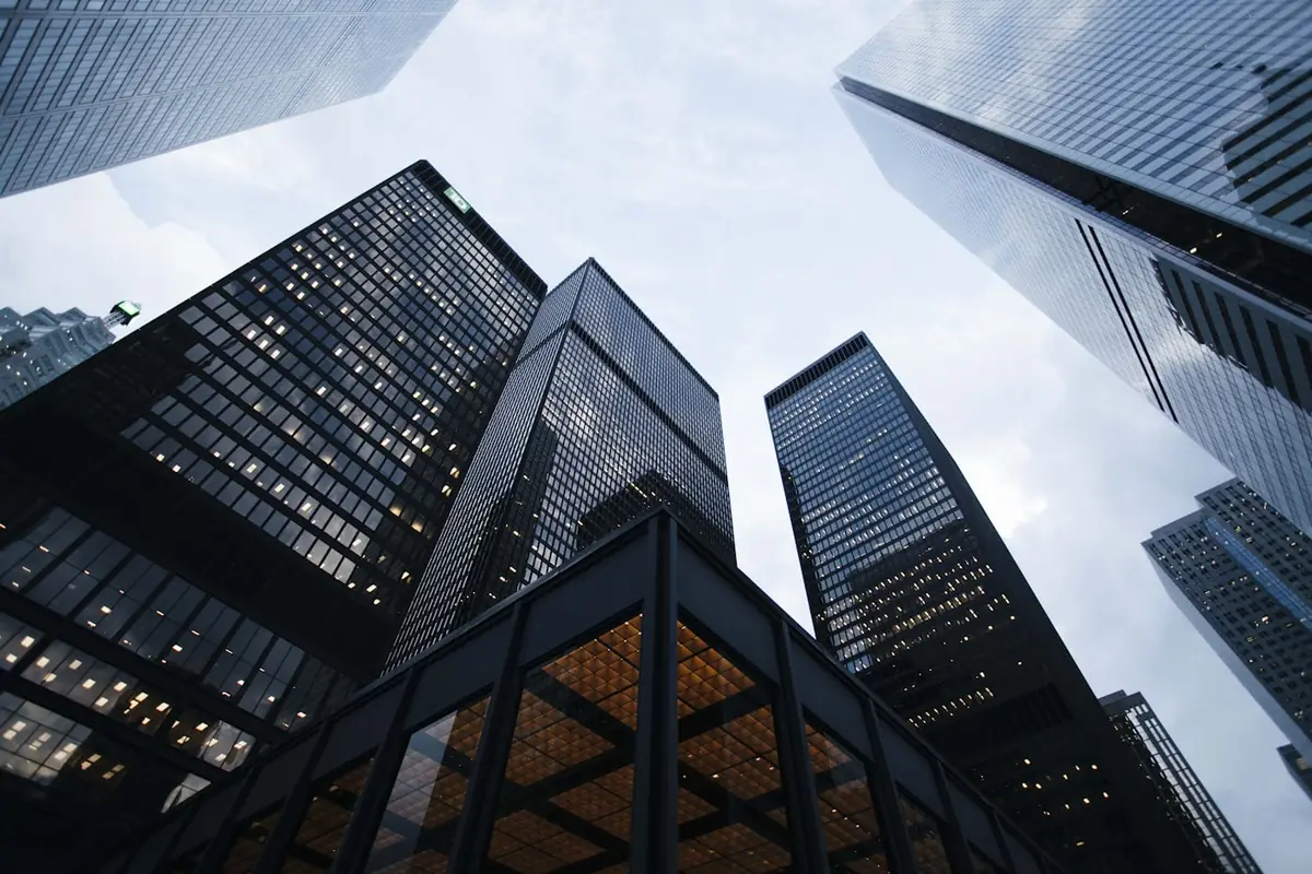 Modern corporate towers viewed from below, conveying enterprise scale
