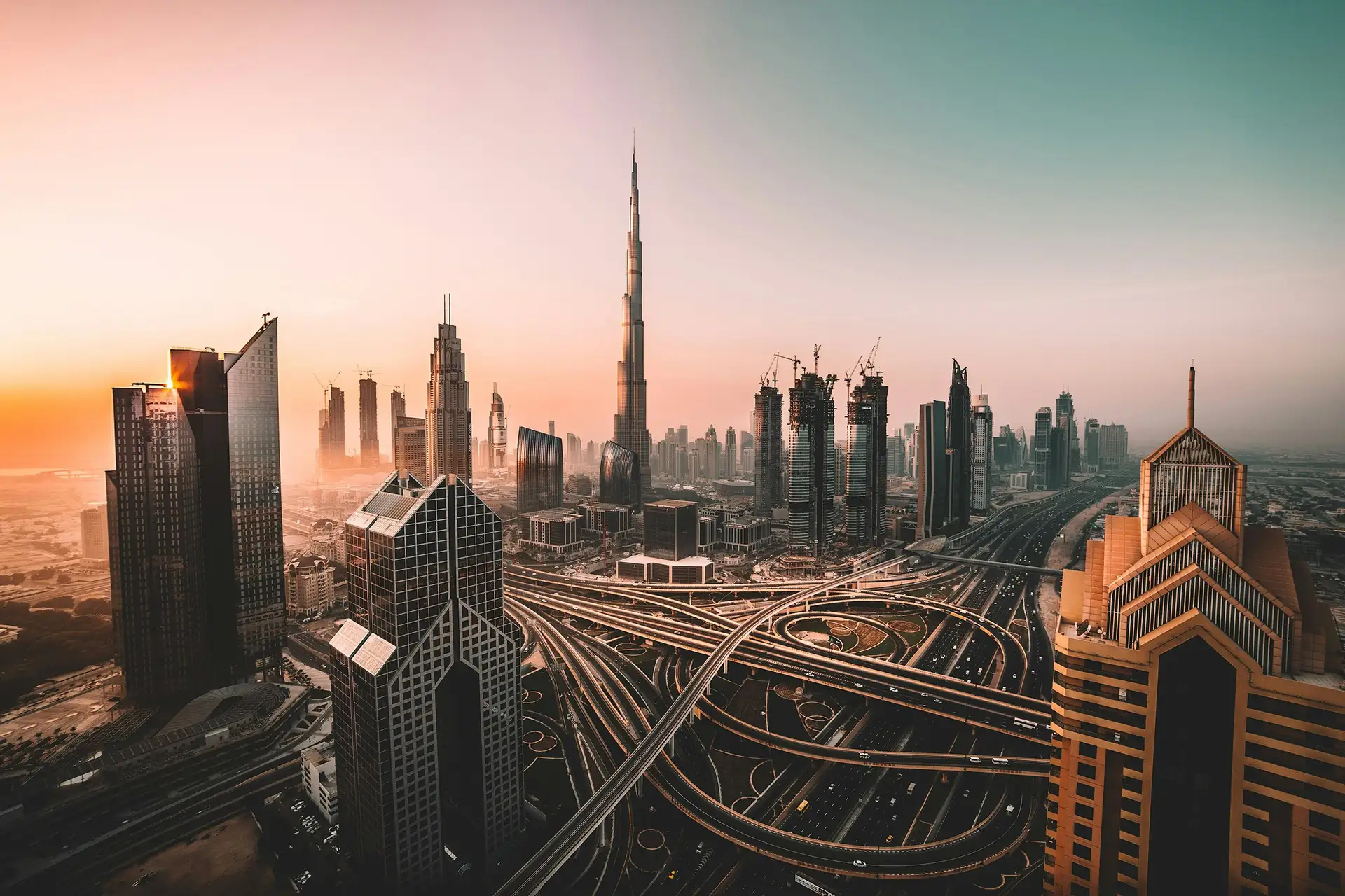 Dubai skyline at dusk, with the Burj Khalifa and Sheikh Zayed Road